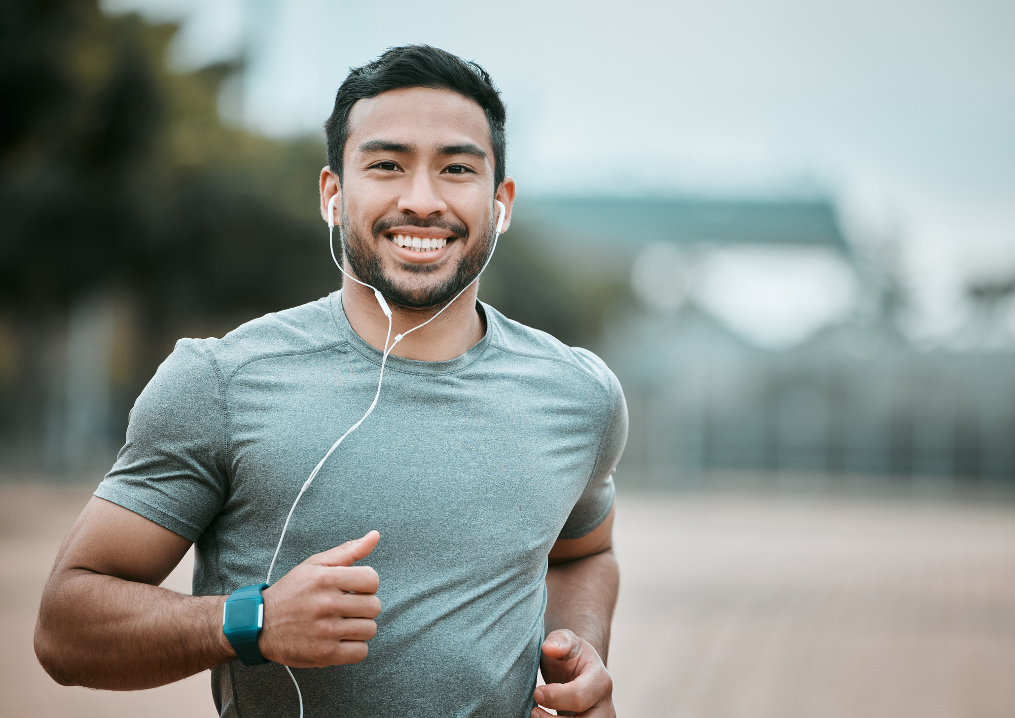Man on an outdoor run wearing ear buds